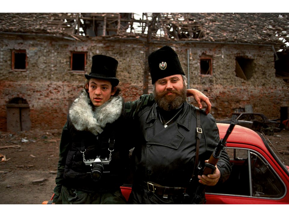 Blood and Honey: A Balkan War Journal
Serbian father and son pose on newly captured territory. Fall 1991.
ronhaviv.com
